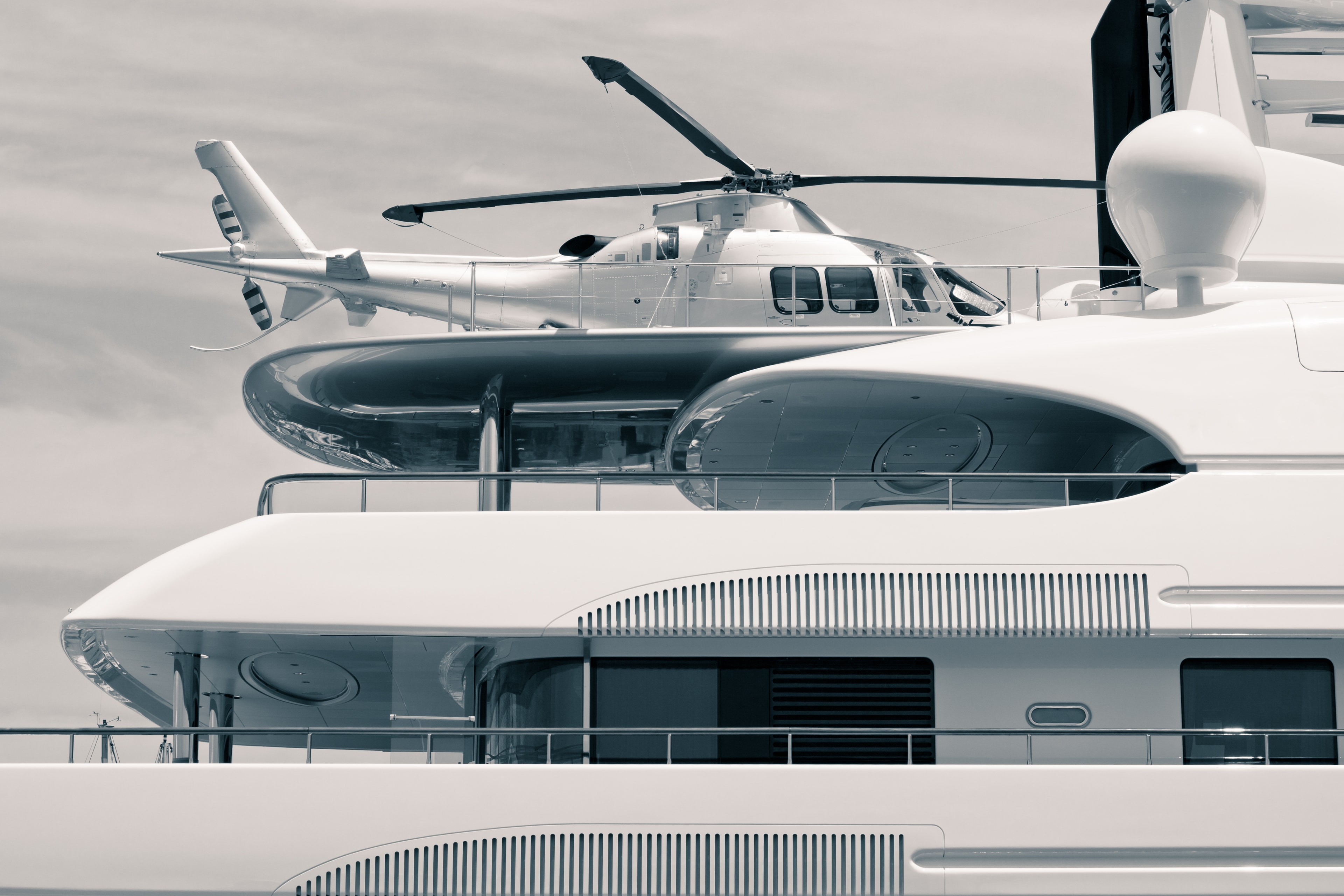 Luxury yacht with helicopter pad, side view