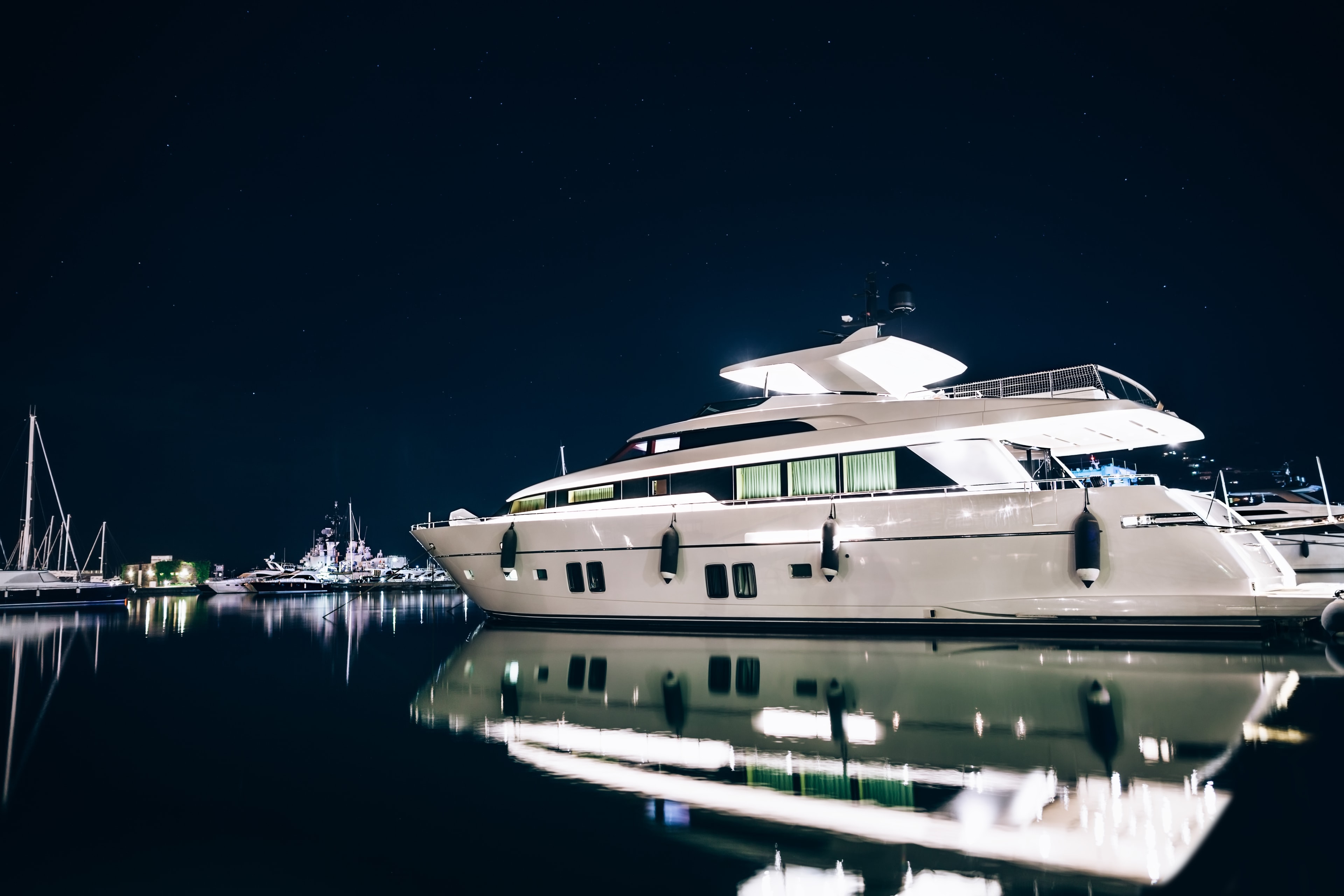 Luxury yacht moored at night harbor
